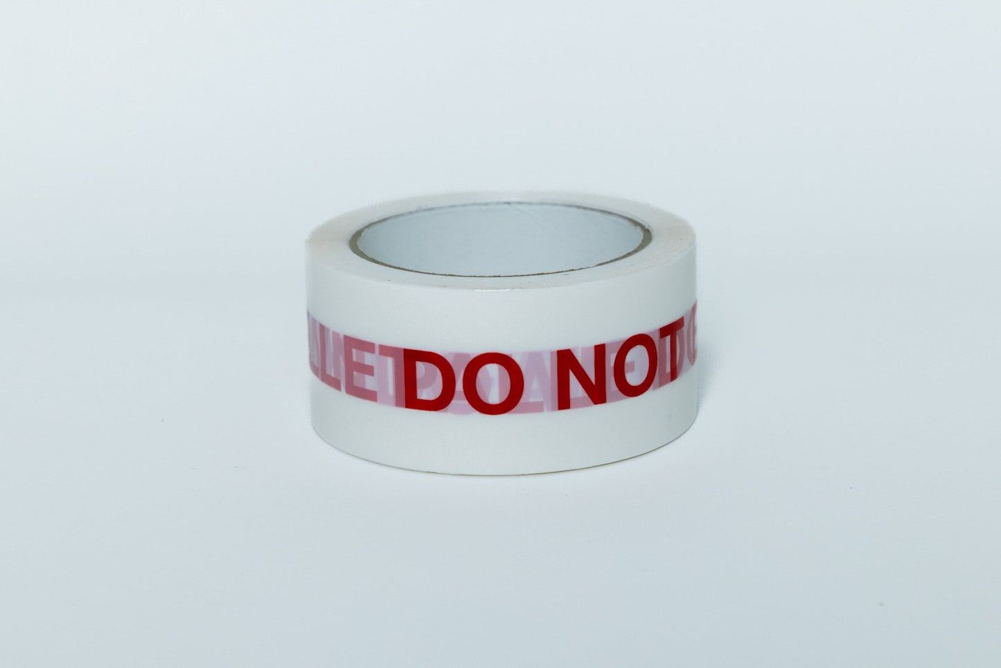 Roll of tape with 'DO NOT' text on a white background