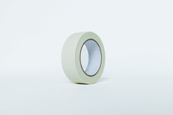 Roll of green tape on a white background