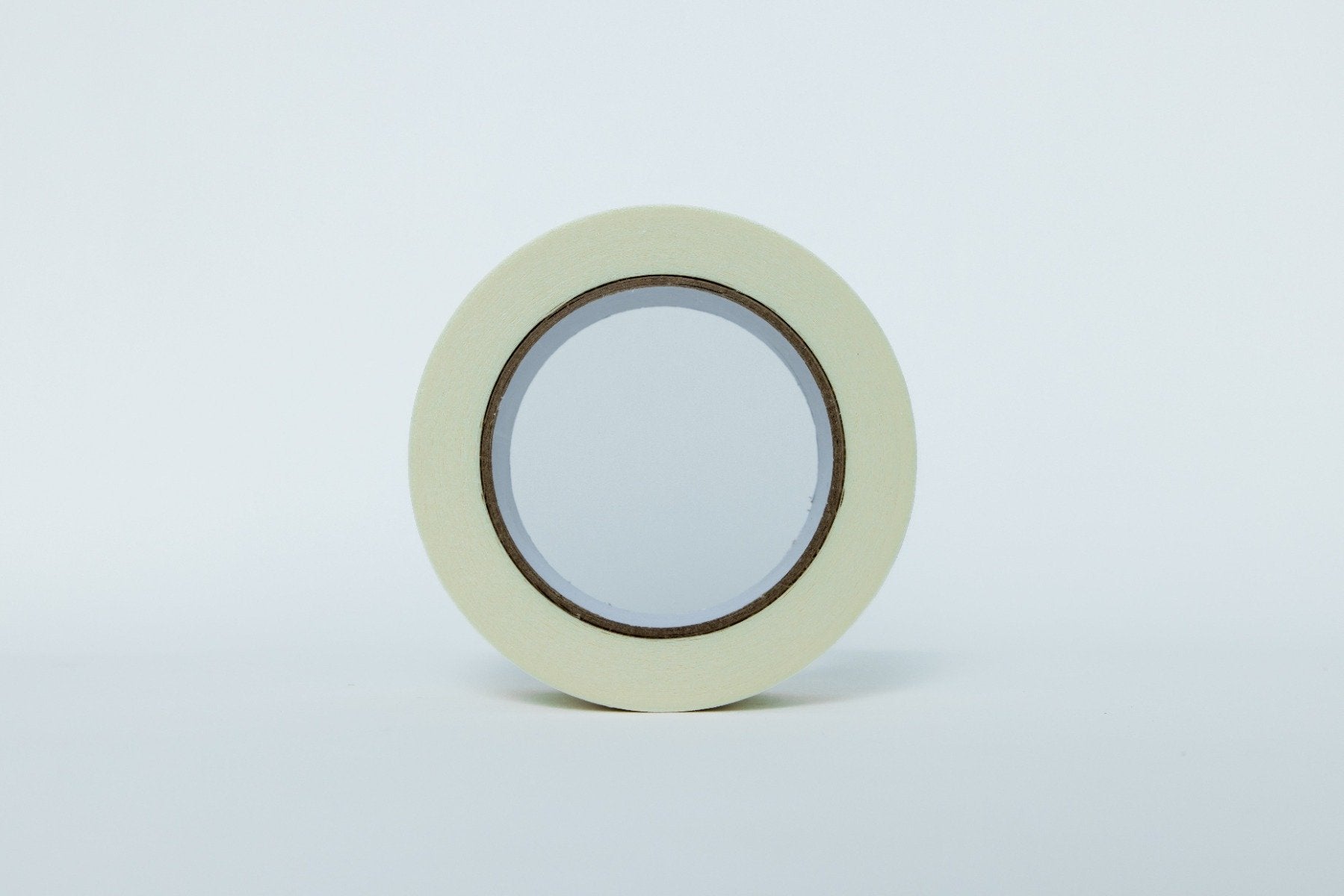 Roll of tape on a light gray background
