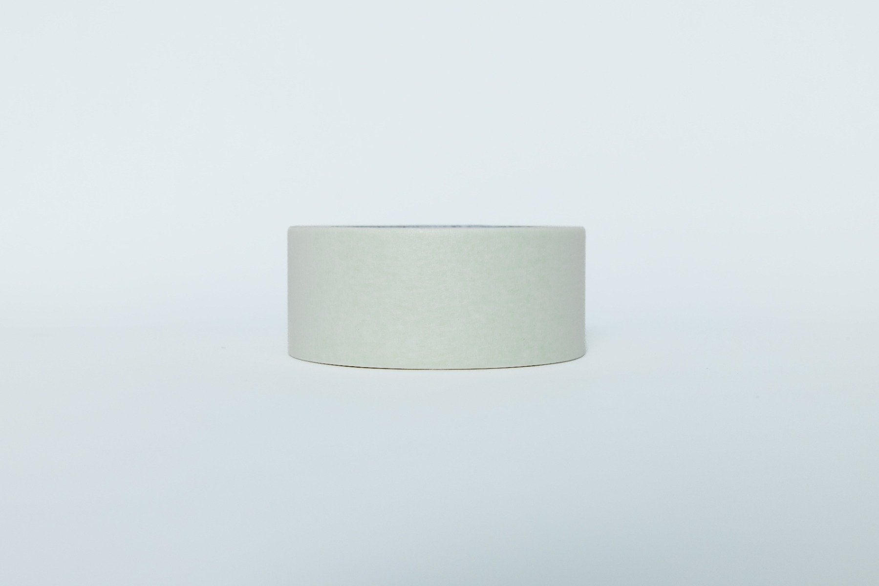 Light gray cylindrical object on a white background