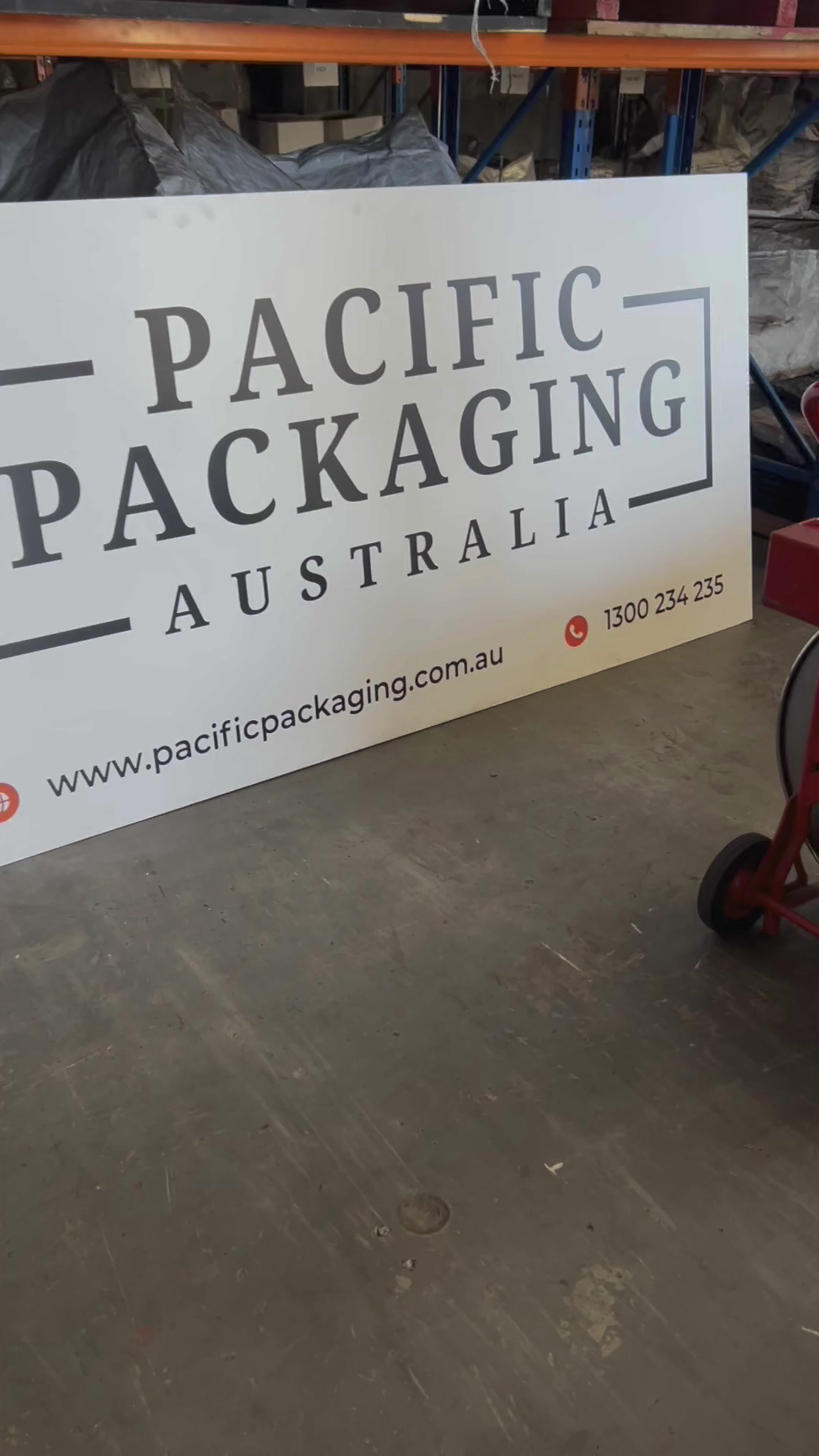 Manual PET strapping demonstration using tensioner tool to secure palletised load – Pacific Packaging Australia industrial packaging solution