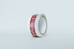 Roll of tape with red text on a light gray background