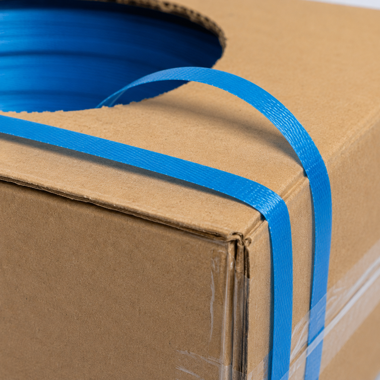 Close-up of 12mm polypropylene hand strapping on dispenser box