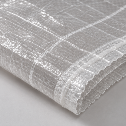 Close-up of transparent woven polypropylene bag showing mesh weave