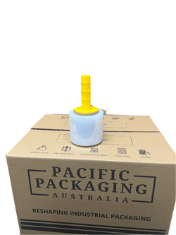 Yellow tape holder with a roll of white tape in it on top of a "Pacific Packaging Australia" box.
