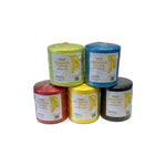 Banana twine spools stacked on white background, assorted colors, label text 'BANANA TWINE' visible