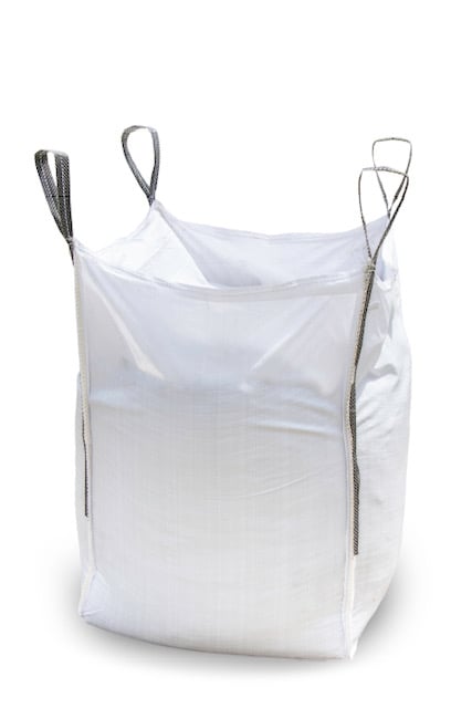 White empty open-top FIBC bulk bag with four lifting loops standing on white background