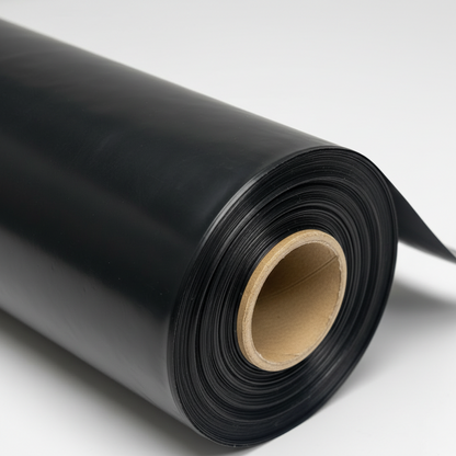 Black plastic film roll wound on cardboard core on white background