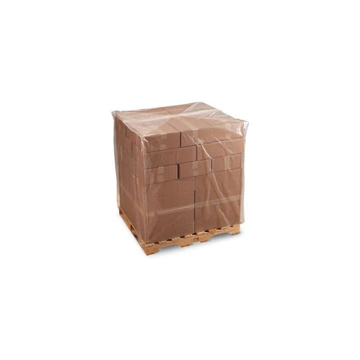 Pallet of stacked cardboard shipping boxes wrapped in clear plastic on wooden pallet against white background
