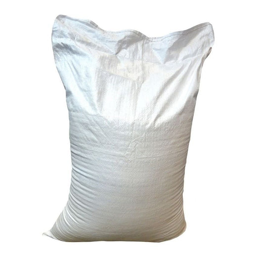 White woven polypropylene bulk sack standing filled on white background